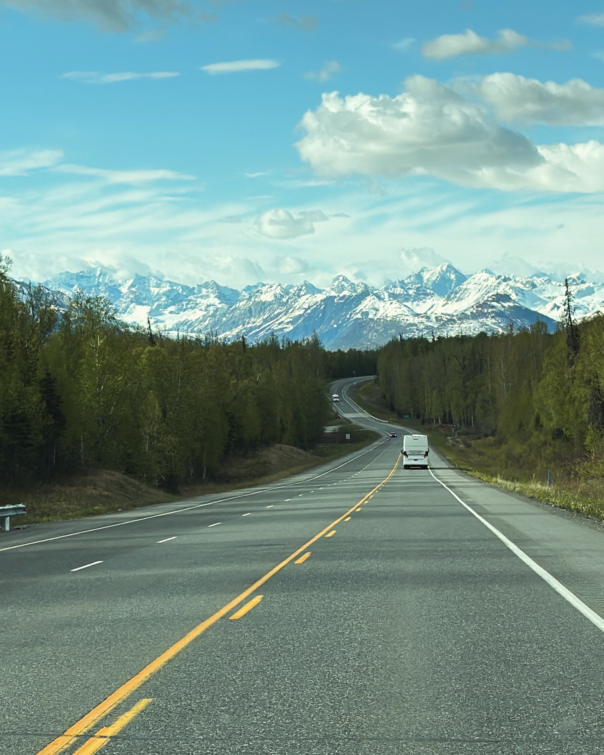 Open road leading into the mountains.