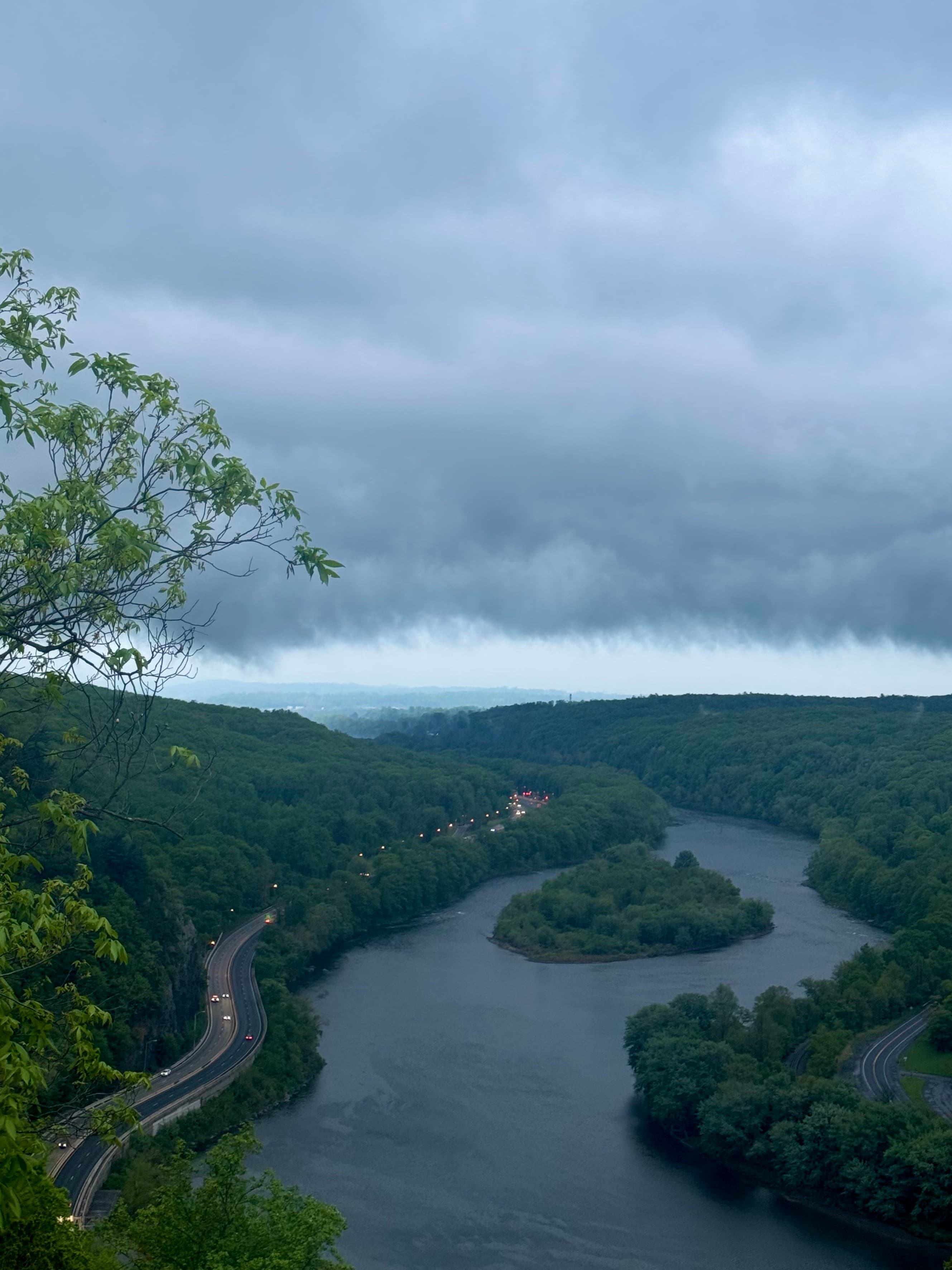 Storm clouds over a winding river.