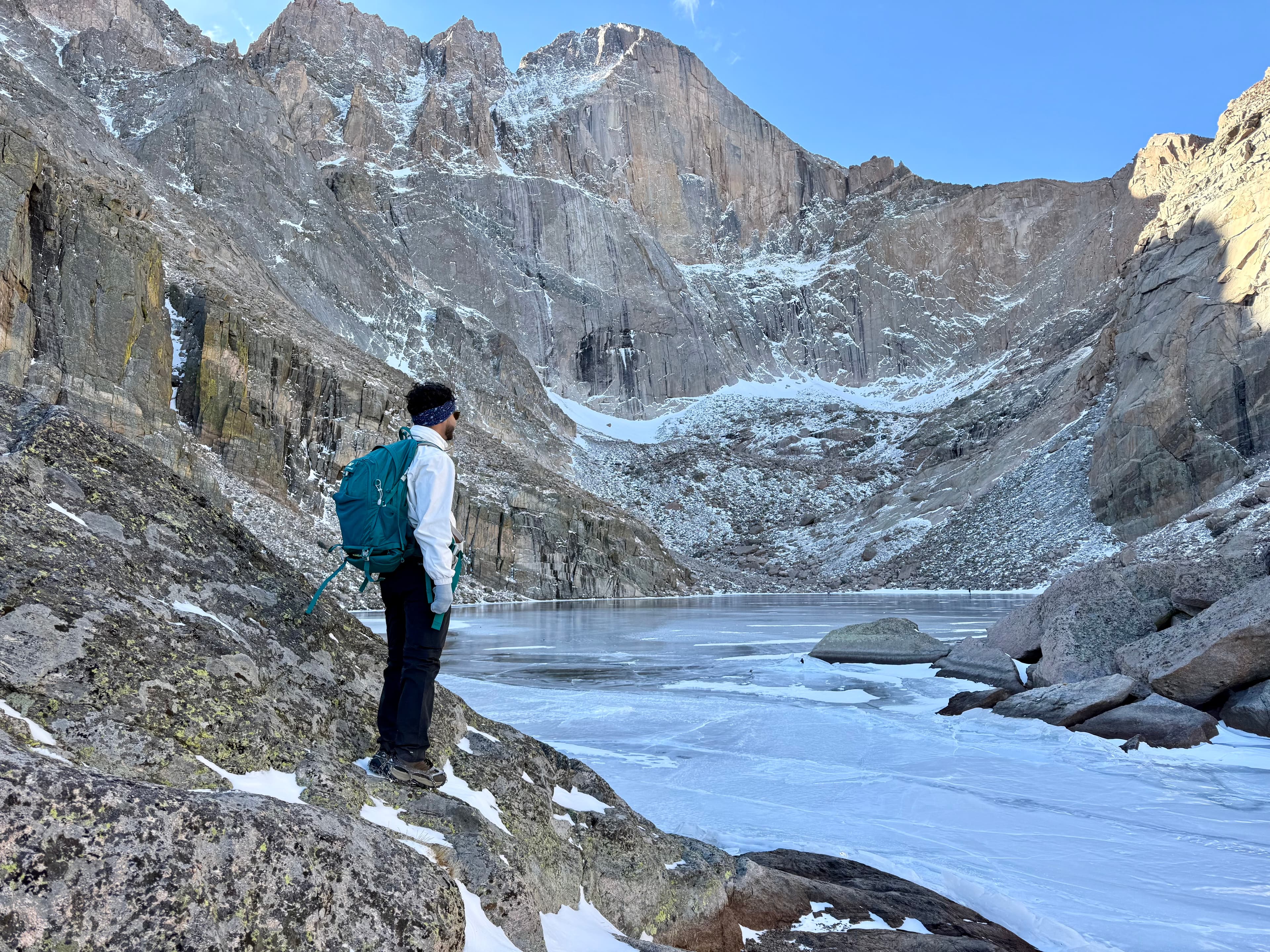 Alpine lake beneath towering cliffs.