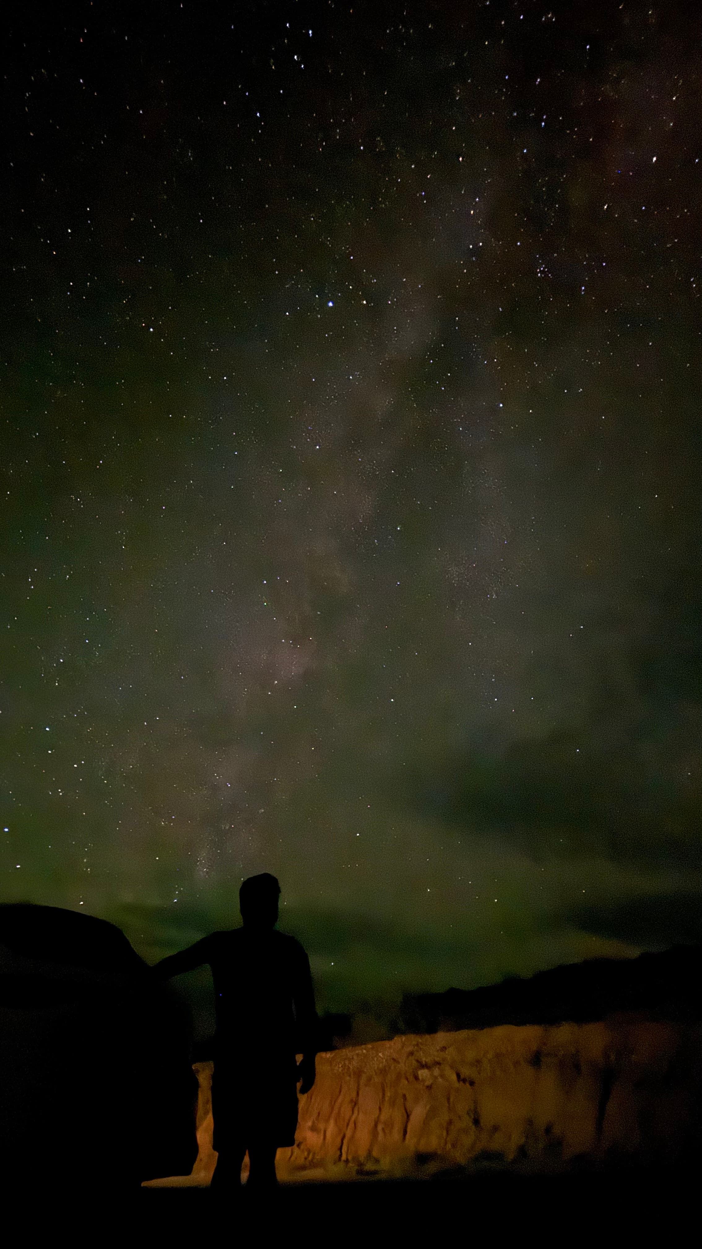 Silhouette under the Milky Way.